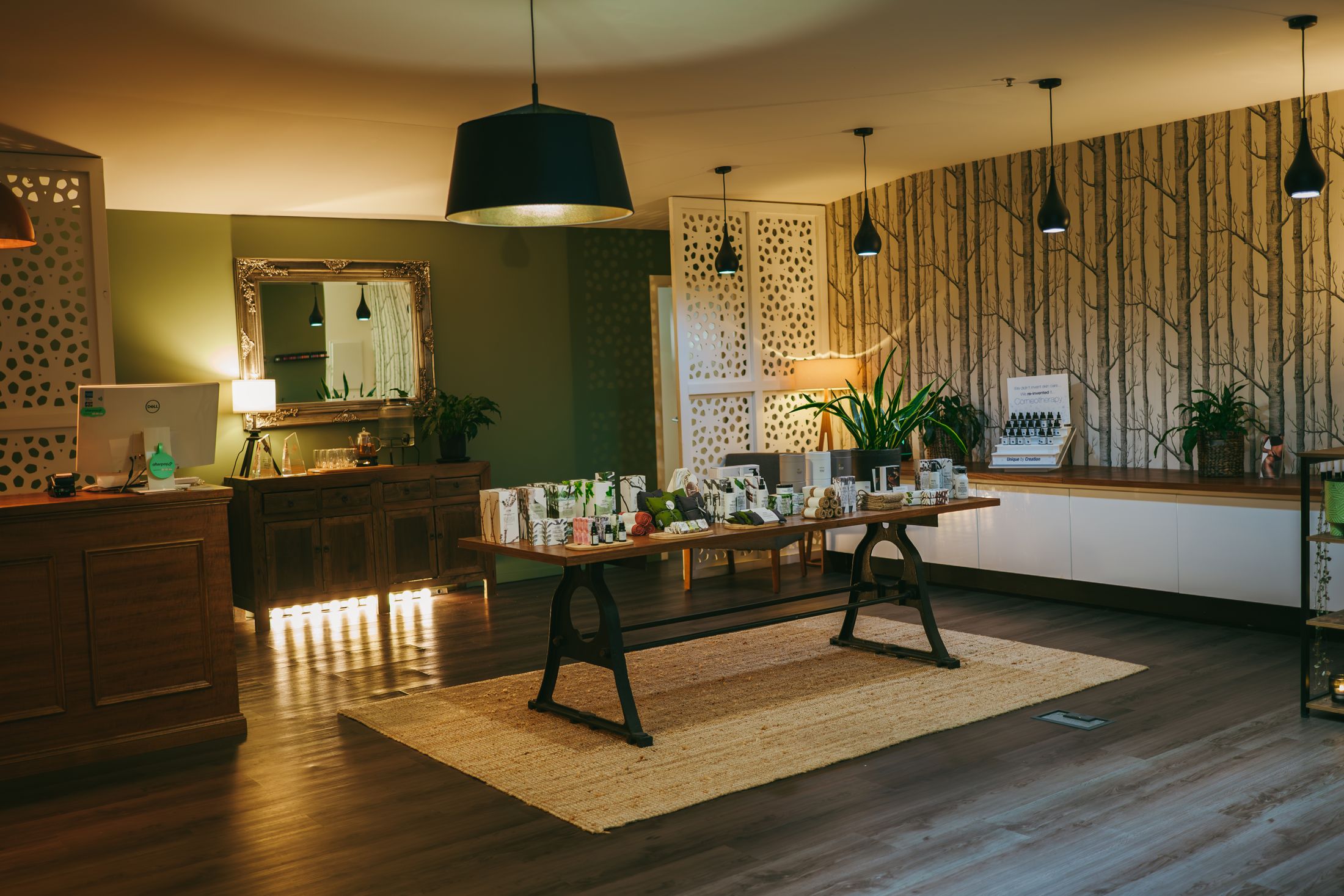 Nourish reception with product display and olive walls