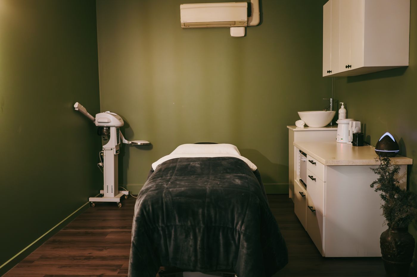 Treatment room with facial bed and steamer
